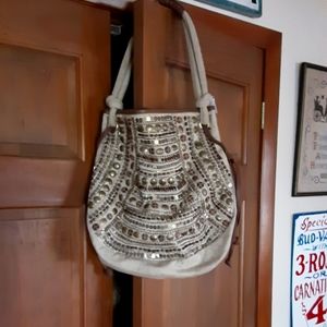 Shoulder bag with metal embellishments